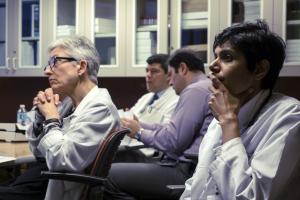 Associate Professor Kimberly Muczynski (left) and nephrology fellow Anupama Nair (right) participate in Professor Rounds clinical case presentations on GN disease