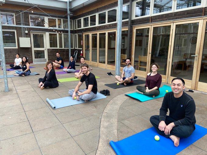 Fellows doing yoga at retreat