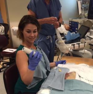 Fellow Carrie Minnelli getting ready to biopsy a pig kidney at the WISH simulation lab.