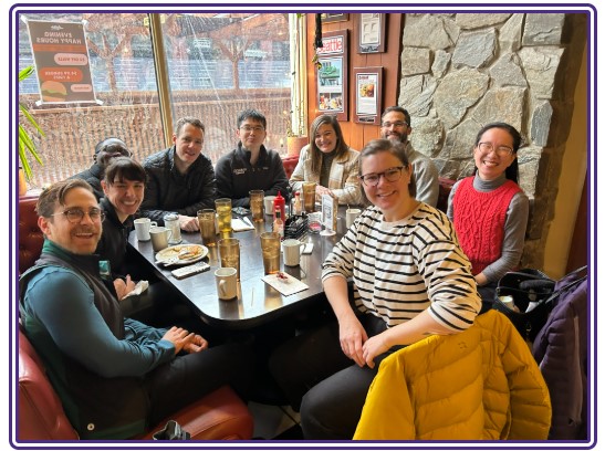 Felllows at restaurant table